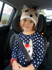 Little girl in reindeer knit hat