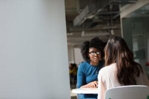 Hiring New Employees Women at a table talking