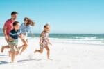 Can I Pull My Child out of School Family running on the beach