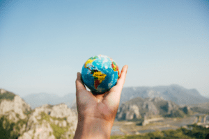 Pandemic man holding a globe 