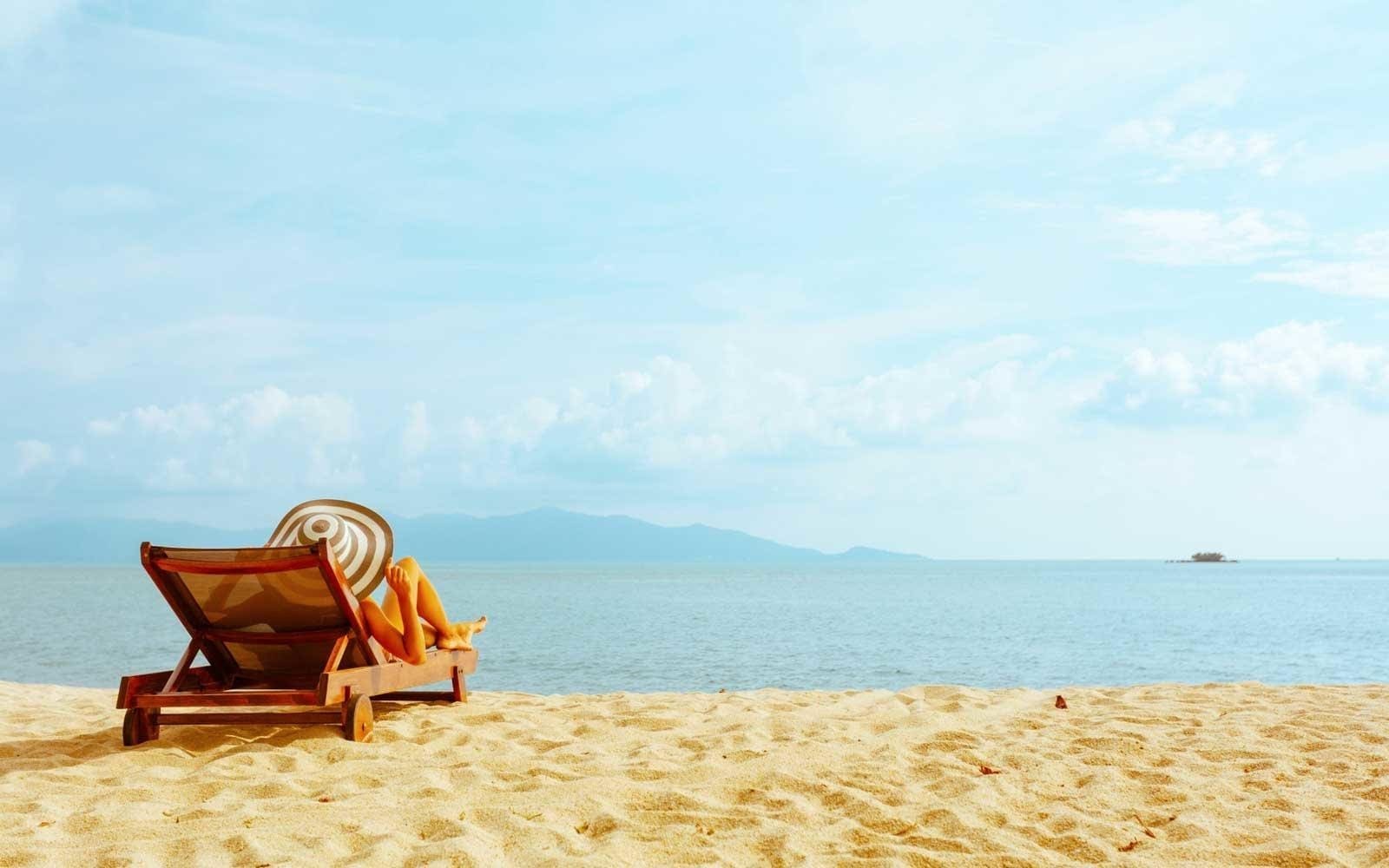 Luxury Swimwear relaxing on the beach