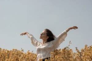 Mental Wellbeing woman in a wheatfield