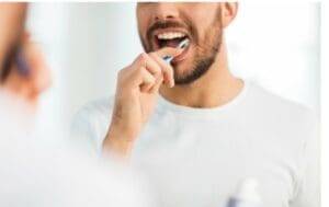 Dental Care Man brushing teeth 