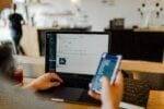 Using Social Media Hands holding a phone. Build An Audience For Your Online Business Using Social Media