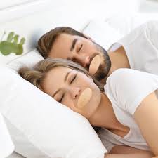 Snoring Remedies couple using mouth tape for sleep