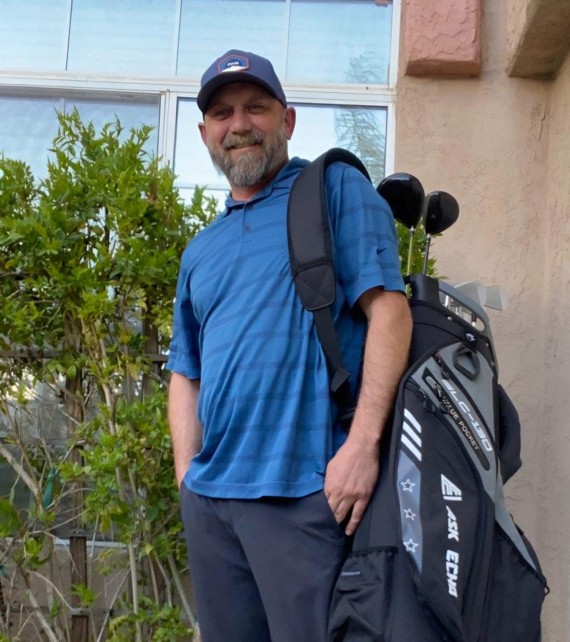 man with a golf bag