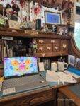 Self-care cluttered desk with Dowan candle
