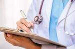 Doctor taking notes Hurt by a Defective Drug