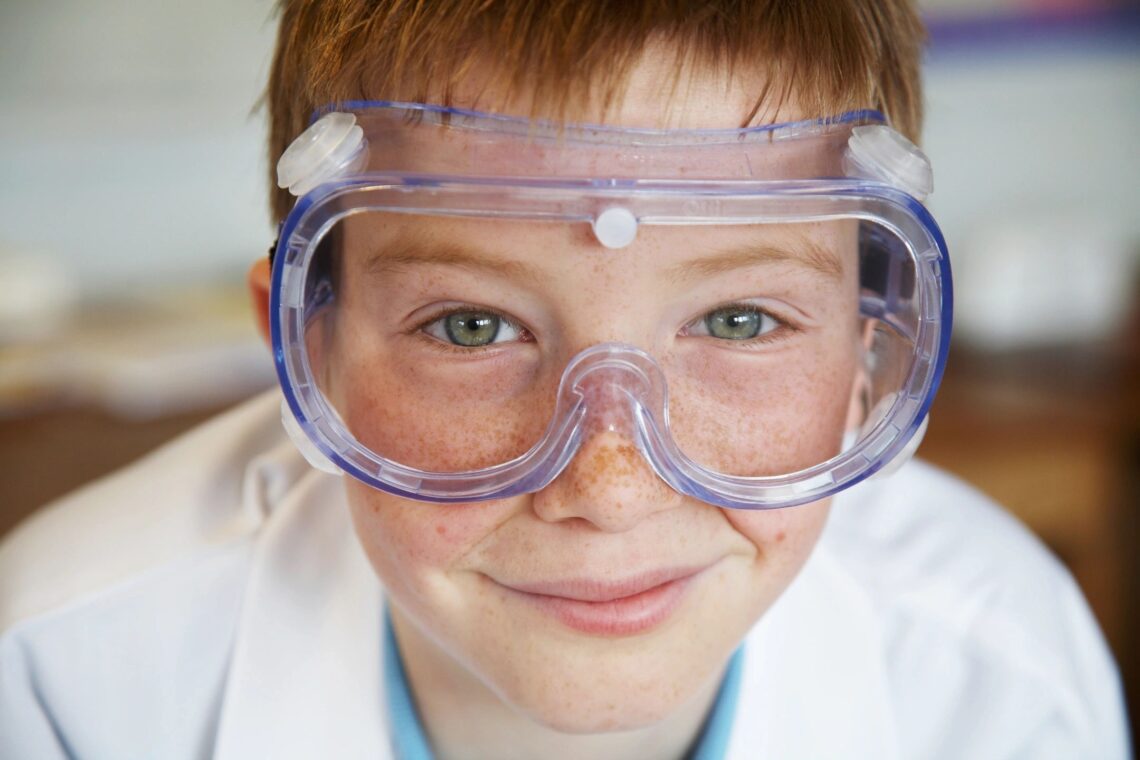 Science little boy with protective eyewear