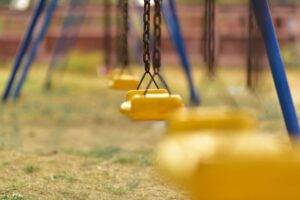 Keep Their Kids Safe from Sexual Predators empty swings