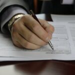 Man signing papers mortgage
