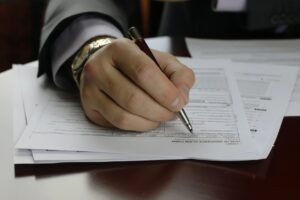 Man signing papers mortgage 