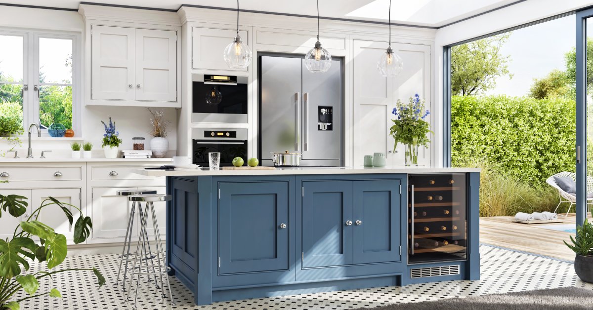 A modern kitchen with white cabinets, a blue center island, and stainless steel appliances on a sunny day.