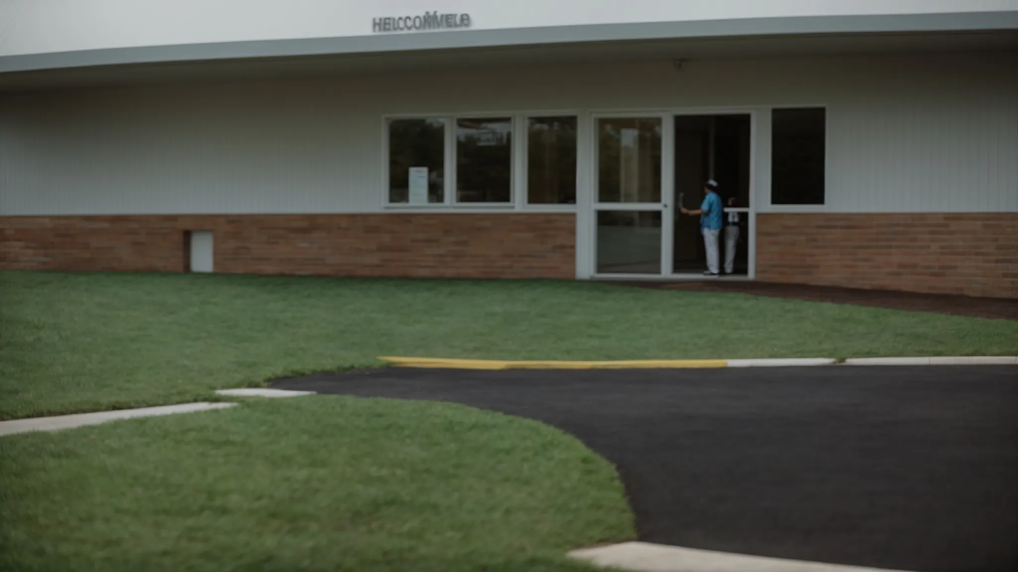 a person stands at the entrance of a welcoming rehab facility, taking the first step on their journey to recovery.