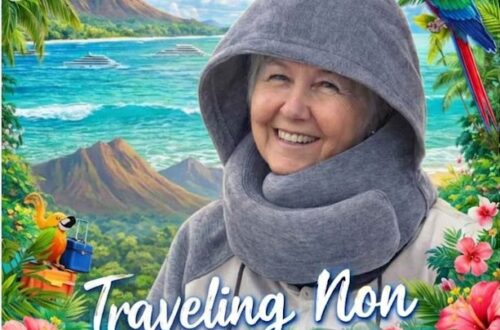 The traveling Non a lady wearing a travel pillow with a hood
