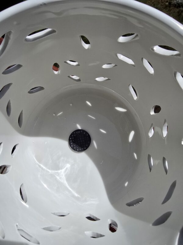 drain hole in a ceramic orchid pot indoor gardening