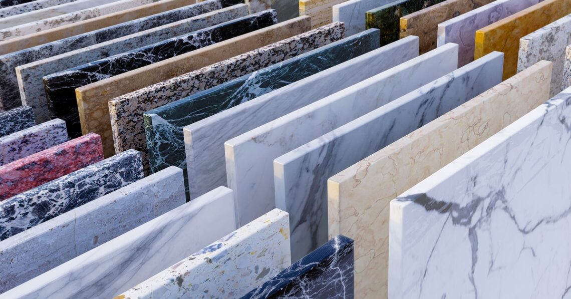 Rows of square natural stone samples in a range of colors showing different variations and patterns.
