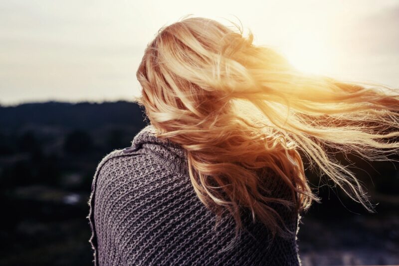 healing after sexual assault a woman with long blonde hair staring at the sunset 