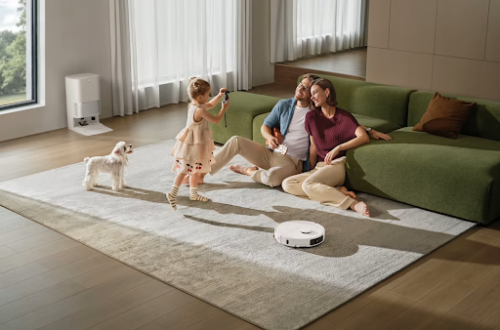 Parents sitting on the floor with a child playing. Smart Home Maintenance