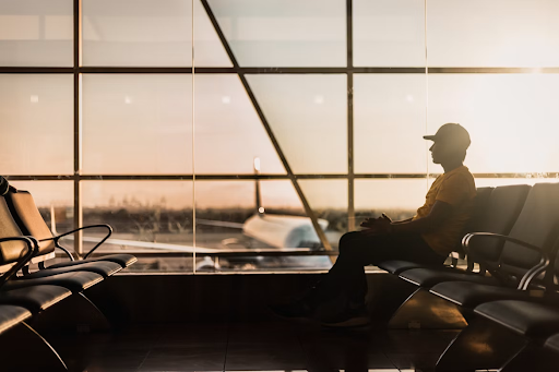 Unexpected Delays? Stay Calm and Prepared A man sitting at an airport