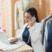 woman on the phone in a clothing store.