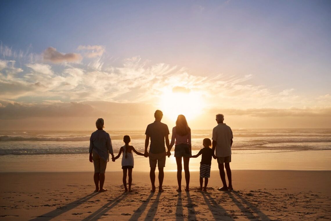 Family on the beach at sunset. Term Life insurance